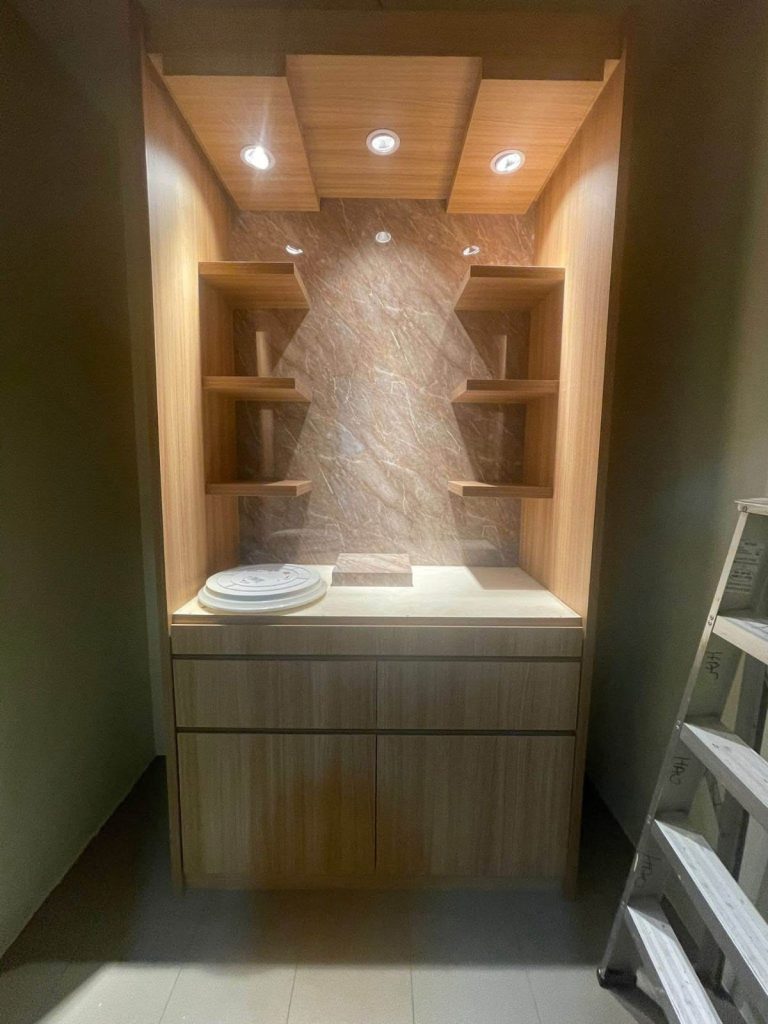 Custom-built timber feature cabinet with integrated lighting – design and build project.